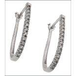 A pair of diamond earhoops, of elongated design, the fronts set with single-cut diamonds, mounted in