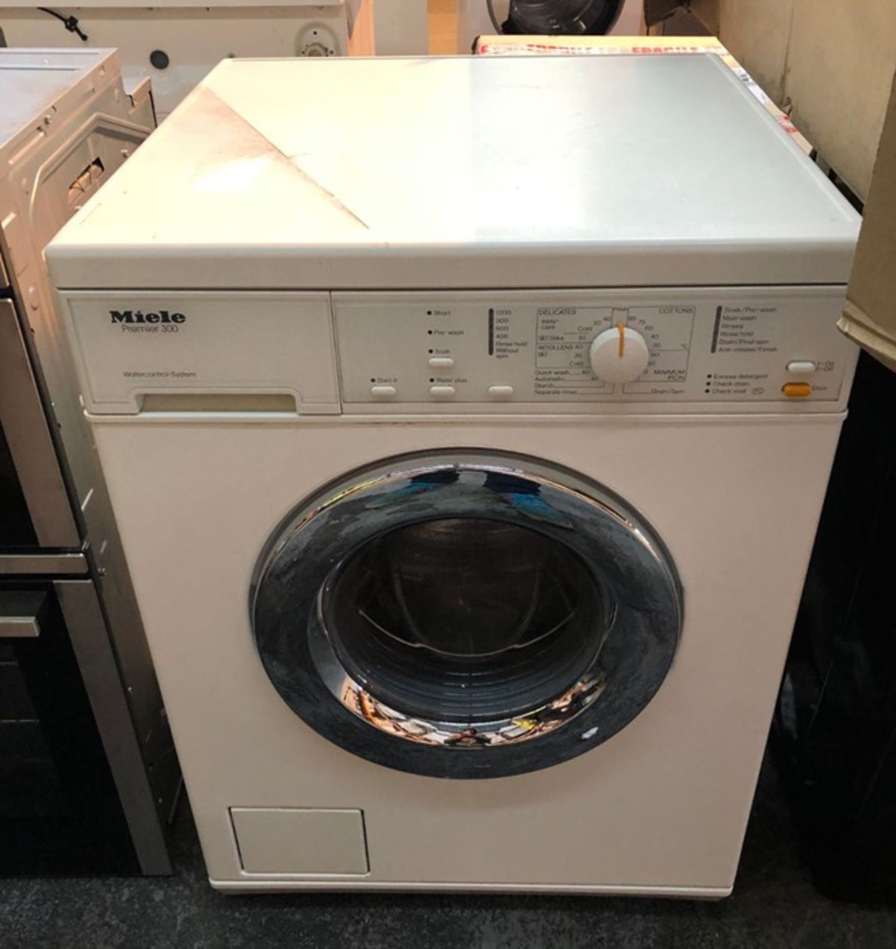 MIELE WASHING MACHINE / CONDITION REPORT: UNTESTED CUSTOMER RETURN. DOOR DOES NOT APPEAR TO OPEN,