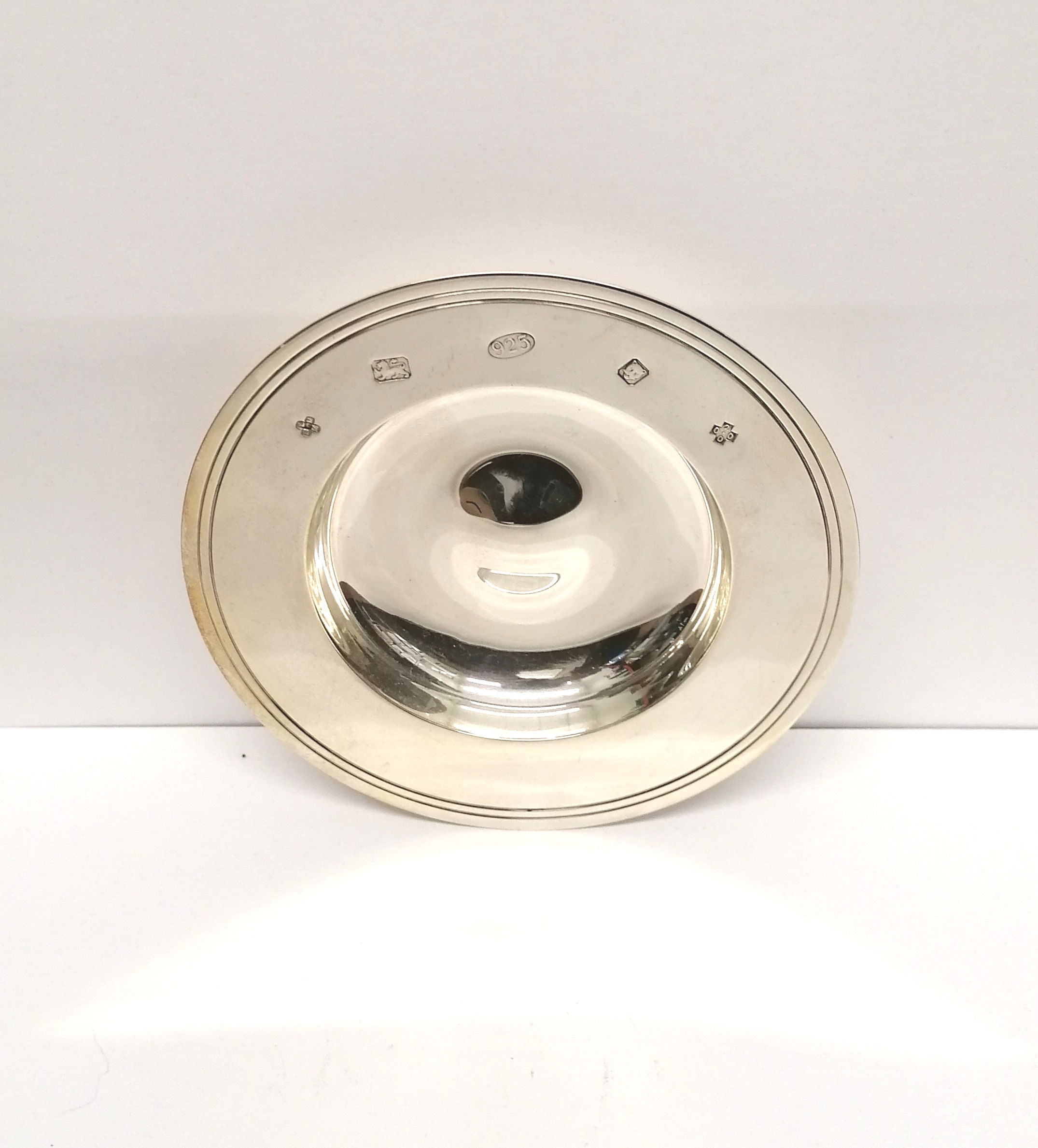 A London silver millennium pin dish dated 2000. 5 cm height, 12 cm width approx. 110 gms approx.