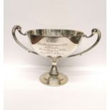 An engraved London silver two handled trophy dated 1931. 10 cm height, 15 cm width approx. 185 gms