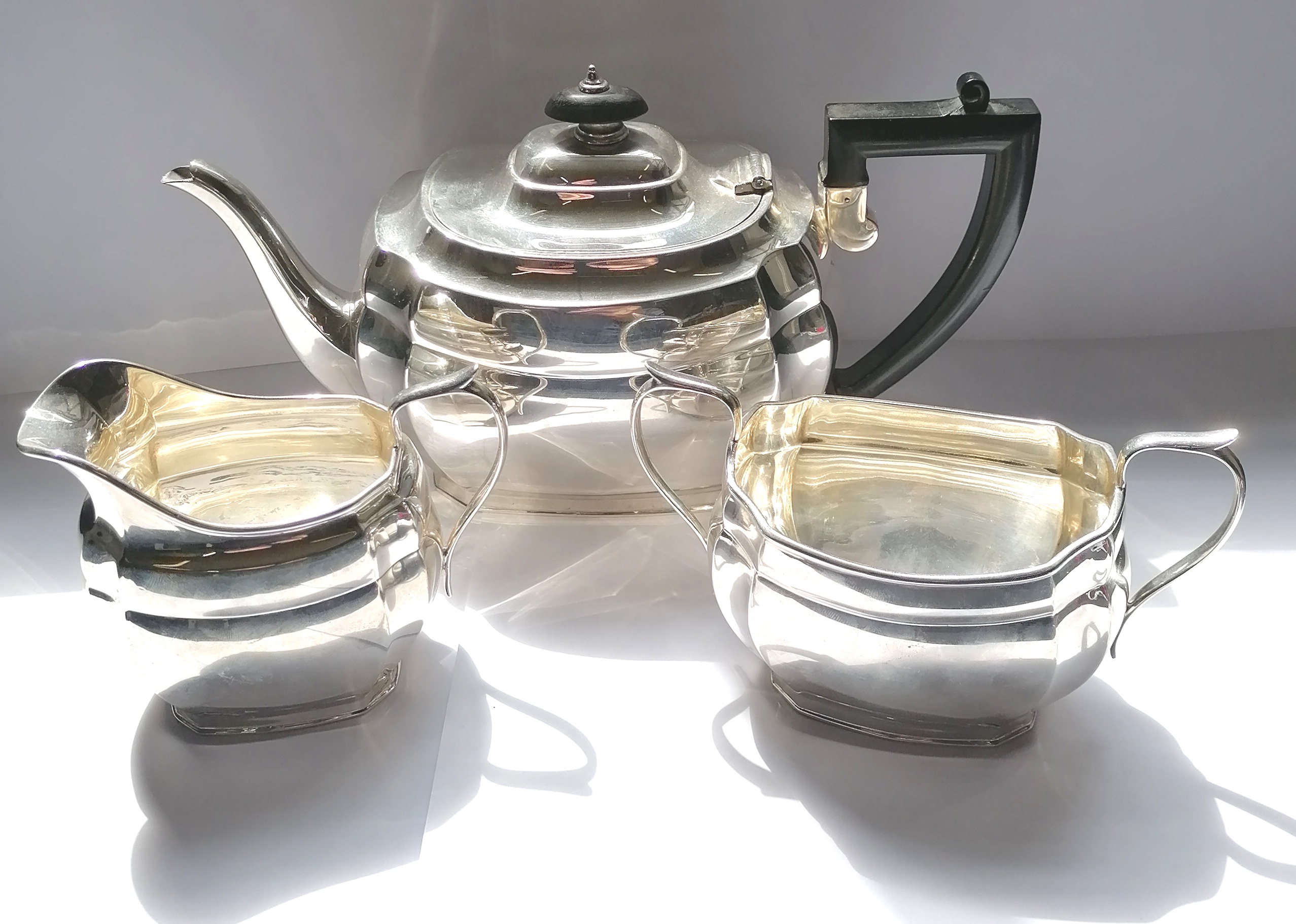 Three piece silver oval tea set with scalloped edge. Edinburgh 1933, makers Hamilton & Inches. 35