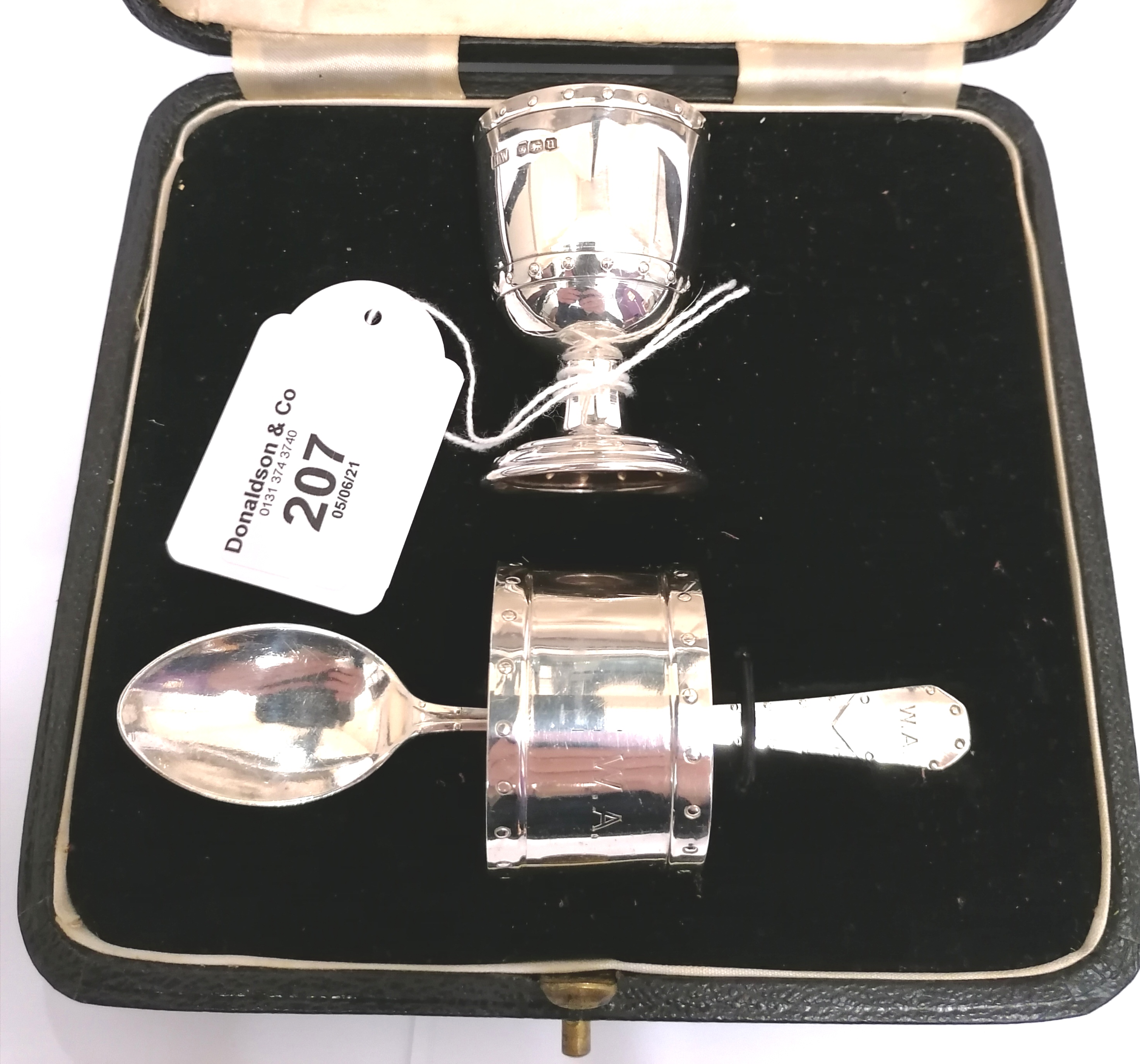 Three piece cased christening set, egg cup, napkin ring, egg spoon. Sheffield 1927.