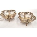 Matched pair of silver pierced quatrefoil Bon Bon dishes on claw feet. Makers Harry Synyer & Charles