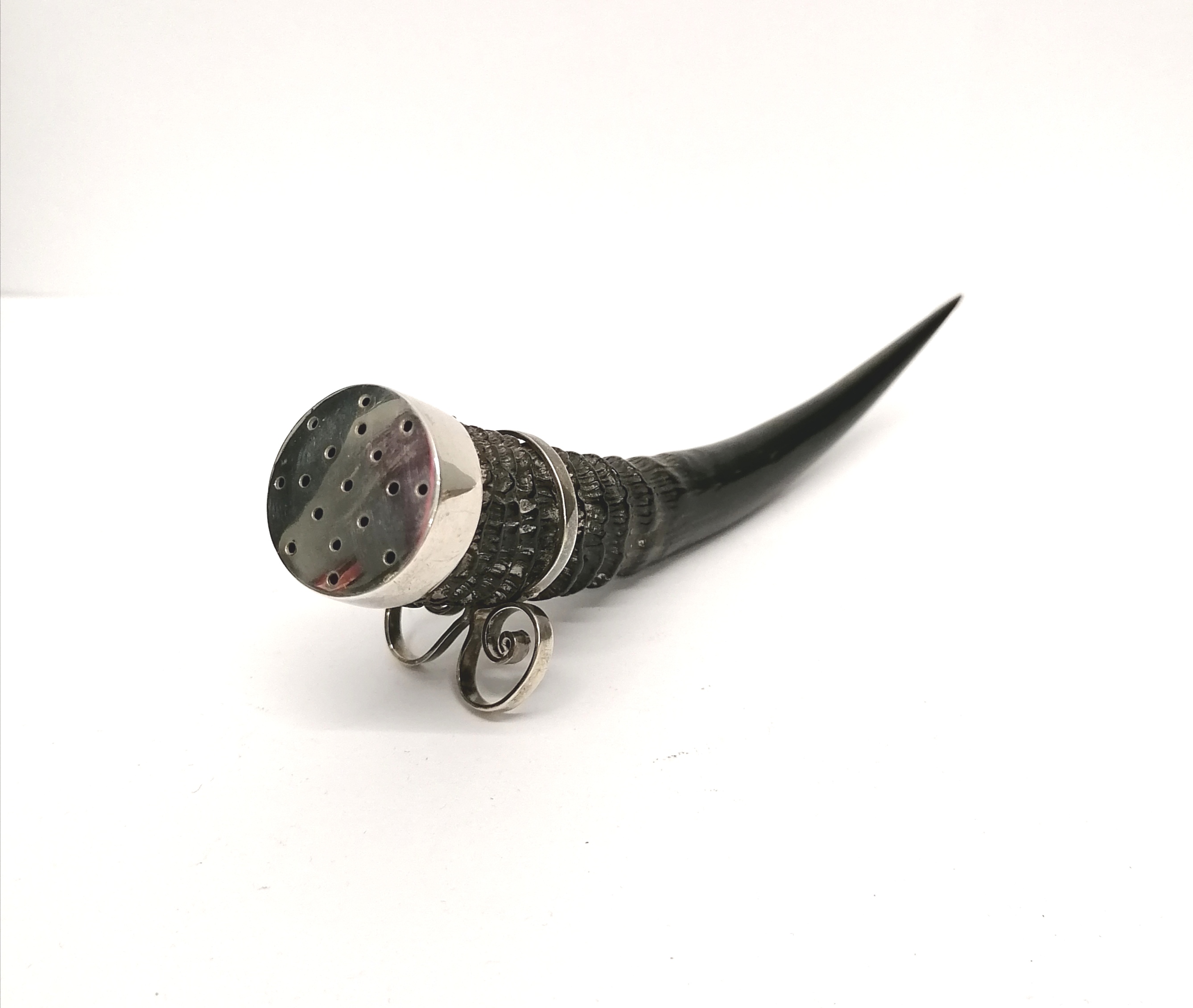A 19th century horn and white metal pepper pot. 4 cm height, 13 cm width approx.