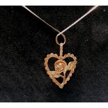 14 K Pendant and chain in the form of a heart and rose circa 1990 4.7 gm.