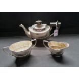 Three piece Victorian silver half lobed batchelor's tea set. Sheffield 1898, makers Joseph Rodgers &