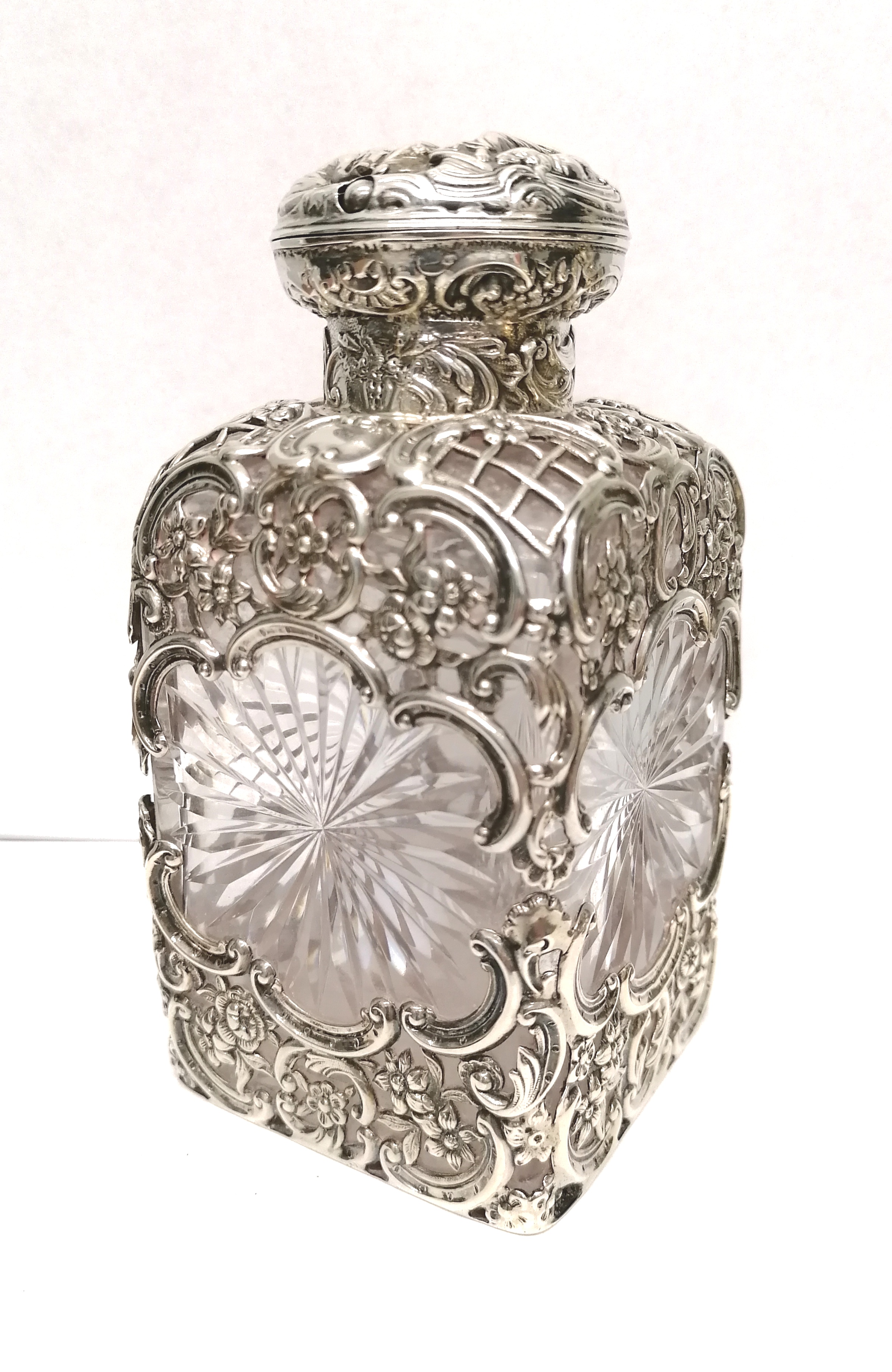 A Victorian silver mounted scent bottle, London. Dated 1894 by William Comyns and Sons. Missing