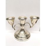 A Birmingham silver triple branch candelabra dated 1967. 10 cm height, 14 cm width approx. 280 gms