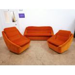 Mid century three piece suite by Vono comprising of his and her armchairs and sofa. Upholstered in