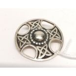 An Iona silver targe brooch. 4 cm width approx.