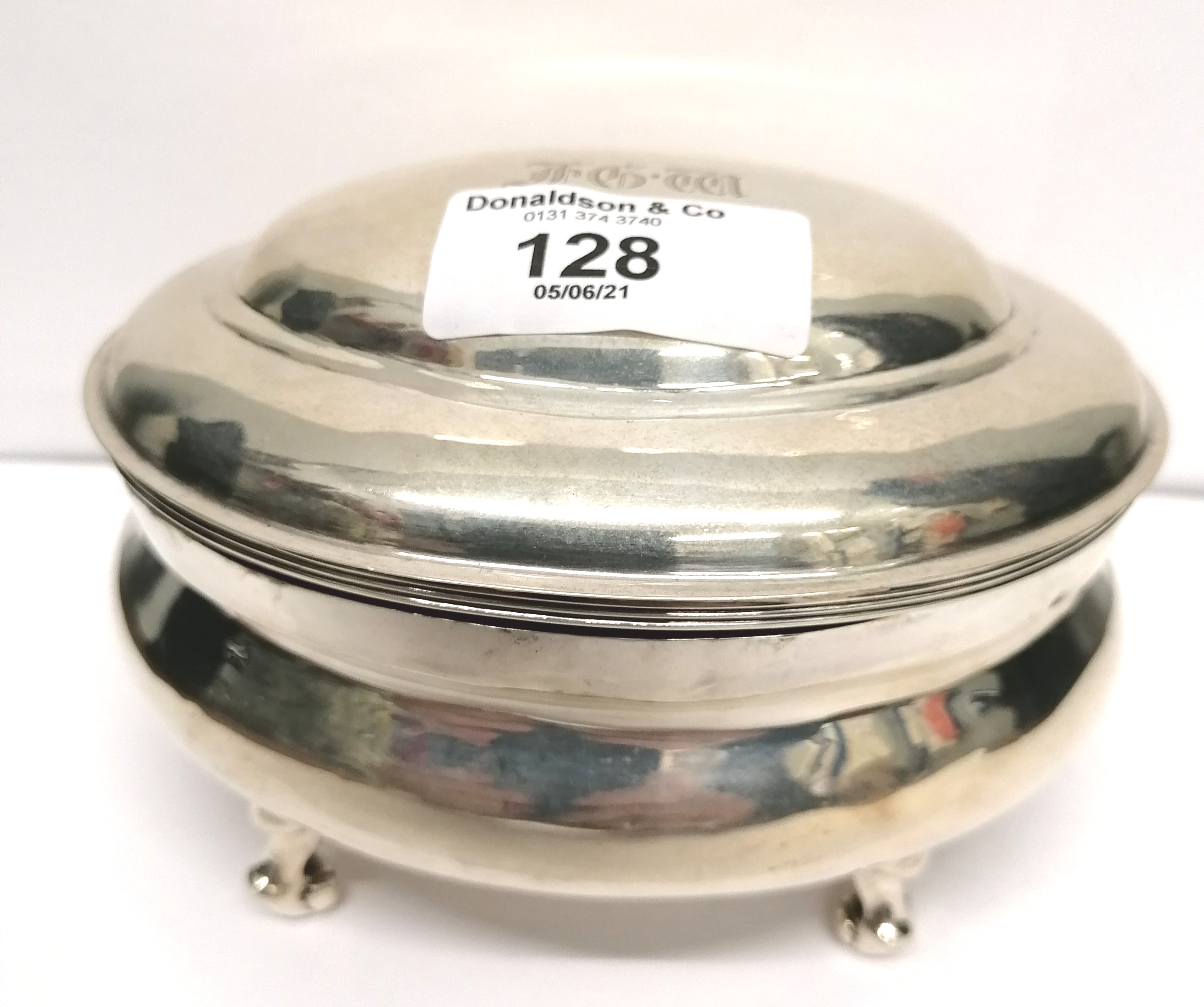 A London silver oval trinket box dated 1907 with initials engraved to lid. 8 cm height, 13 cm