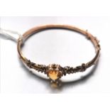 Gold bangle inset with citrine circa 1900.