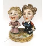 A pair of early 19th century Crown Derby dwarf comics. 9.5 cm height, 8.5 cm width approx.