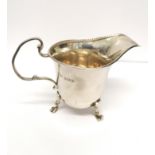 A Birmingham silver cream jug dated 1937 by Wilson and Sharp Ltd. 8 cm height, 11 cm width approx.