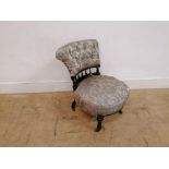 A late Victorian ebonised button nursing chair.
