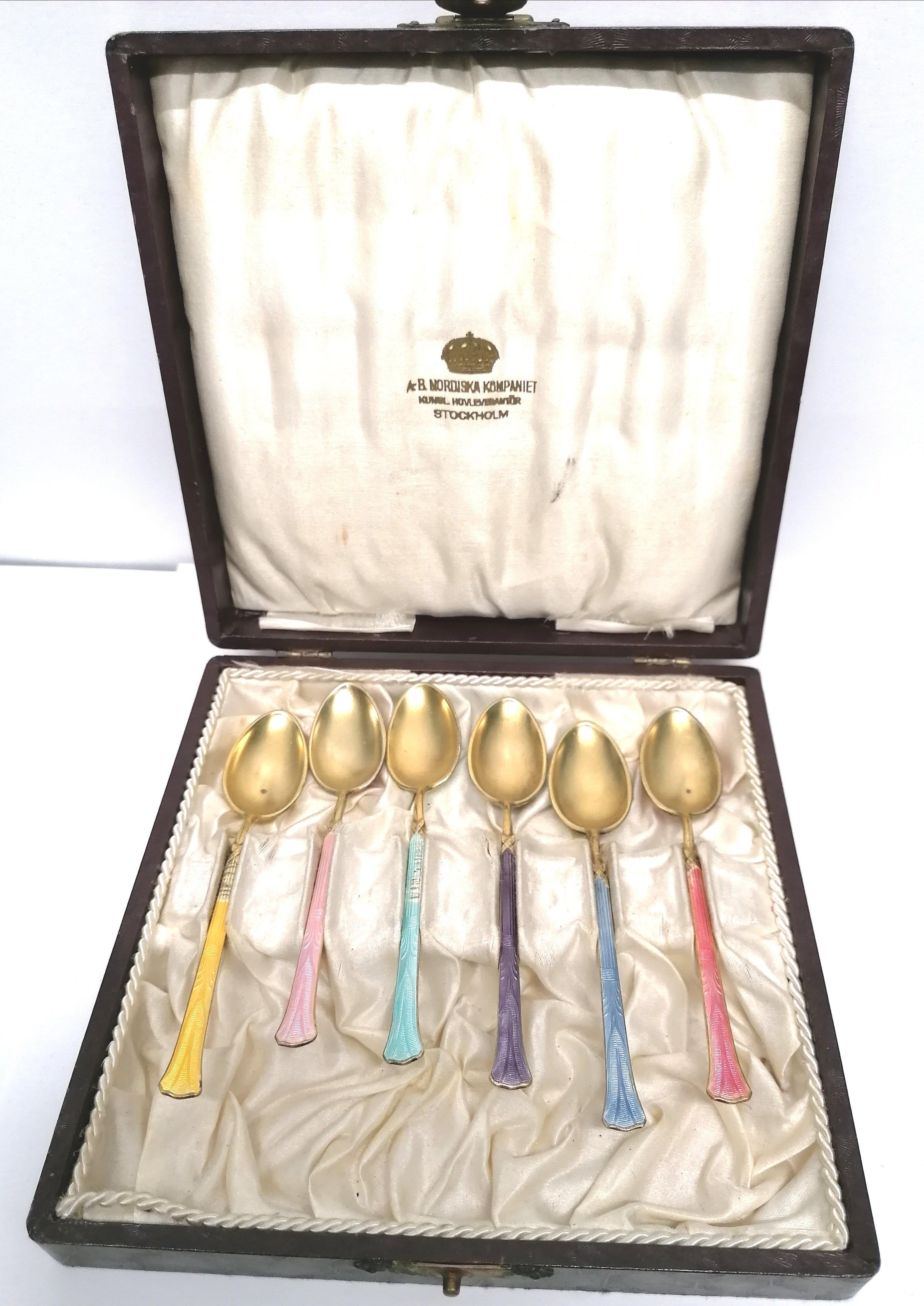 A set of Swedish silver gilt enamel spoons complete with original box.