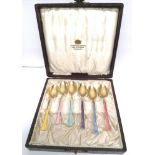 A set of Swedish silver gilt enamel spoons complete with original box.