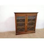 19th century mahogany bookcase having a dental fixed cornice to top over astragal glazed pannel