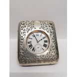 A silver cased travel clock, Chester 1899. 11 cm height, 10 cm width approx.
