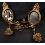 A pair of reproduction brass mirror backed sconces. 24 cm height, 24 cm width approx.