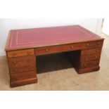 A 19th century mahogany twin pedestal partners desk having inset red leather skiver to top, above