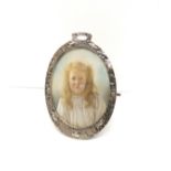 A Victorian white metal picture frame with oval form. 8 cm height 6 cm width approx.