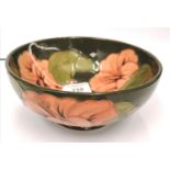 Green Moorcroft bowl of (Hibiscus) design with orange flower heads circa 1960.