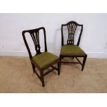 A pair of 19th century mahogany side chairs having a pierced splat back over insert seat raised on