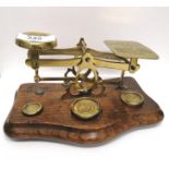 An early 20th century brass postal scale.