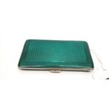 An art deco silver gilt and green enamel ladies cigarette case. 8.5 cm width approx (a.f).