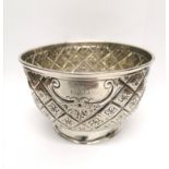A Victorian London silver bowl by Charles Boyton having an engraved and repousse design. 8 cm