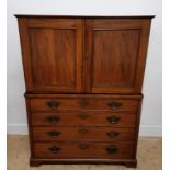 A 19th century mahogany seaman's chest having removable linen press to top revealing writing slope