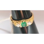 0.0750 (18 ct) Three stone emerald and diamond ring, London 1995.