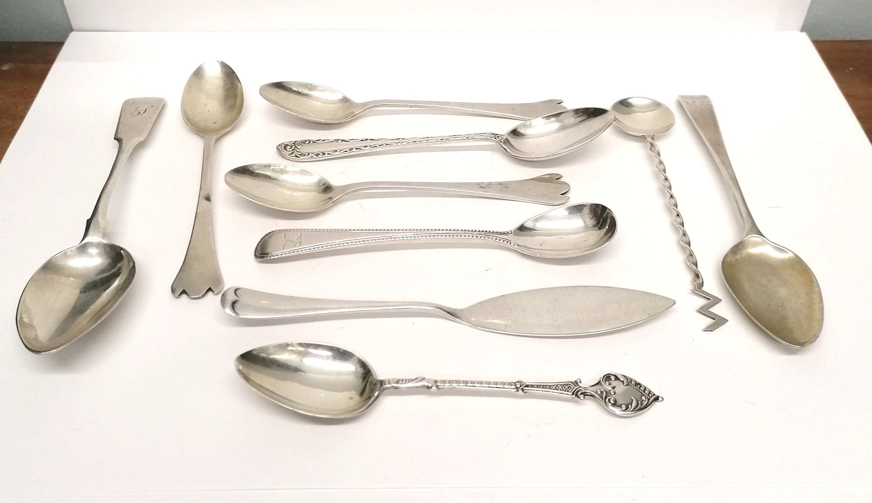 A collection of 18th, 19th and 20th century tea and condiment spoons to include an Aberdeen