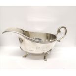 A George V engraved Birmingham silver sauce boat dated 1931. 8.5 cm height, 18 cm width approx.