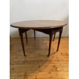 GEORGE III MAHOGANY TURNED LEG OVAL DROP LEAF TABLE, WITH ONE LATERAL FRIEZE DRAW RAISED ON TURNED