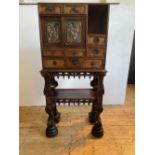 JAPANESE STAINED HARDWOOD, PAINTED COMPOSITION AND METAL MOUNTED CABINET ON STAND, BY SHINOHARA