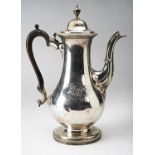 GEORGE II SILVER COFFEE POTWILLIAM HOLMES, LONDON 1718with a scroll wood handle and urn shaped