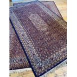 BLUE AND BEIGE BORDER PATTERN MACHINE WOVEN RUG (305cm x 171cm) AND SIMILAR BORDER PATTERN MACHINE