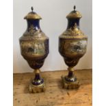 IMPRESSIVE PAIR OF COBALT BLUE-GLAZED AND GILT-BRONZE MOUNTED COVERED VASES19TH CENTURYin the Sevres