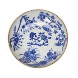 BLUE AND WHITE DISHpainted in tones of underglaze blue with various flowering stems32.5cm diam
