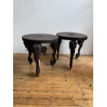 PAIR OF CARVED INDIAN HARDWOOD OCCASIONAL TABLES CIRCA 1900,THE CIRCULAR TOPS CARVED ON ELEPHANT