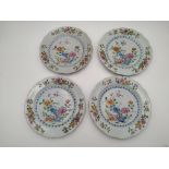 SET OF FOUR EXPORT FAMILLE DISHES QIANLONG PERIOD painted with brightly coloured flowers in a fenced