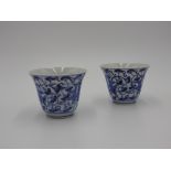 THREE BLUE AND WHITE WINE CUPS 18TH CENTURY painted with stylised lotus and scrolling tendrils 6.5cm