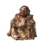 SIMULATED LACQUER STONEWARE BUDDHA QING DYNASTY, 18TH 19TH CENTURY modelled with a joyful expression