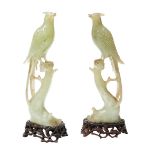 PAIR OF HARDSTONE FIGURES OF BIRDS perched on naturalistic stumps, raised on carved hardwood