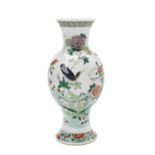 FAMILLE VERTE BALUSTER VASE LATE QING DYNASTY painted with an exotic bird in a rocky outcrop, 23cm