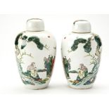 PAIR OF FAMILLE VERTE JARS AND COVERS QING DYNASTY the baluster sides painted with scholars