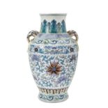 DOUCAI BALUSTER 'LOTUS' VASE QING DYNASTY, 19TH CENTURY the baluster sides painted with a continuous