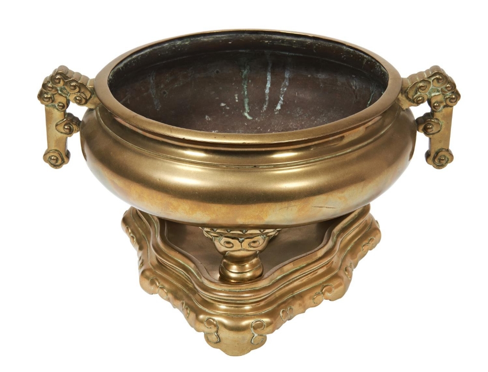 LARGE GILT-BRONZE TRIPOD CENSER AND STAND QING DYNASTY of compressed baluster form, with twin angula